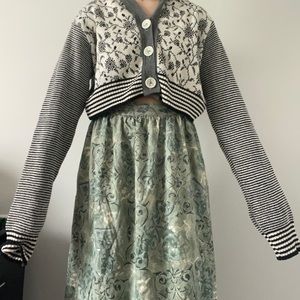 Grey cardigan. Taylor swift vibes lowkey. Cute little design on front